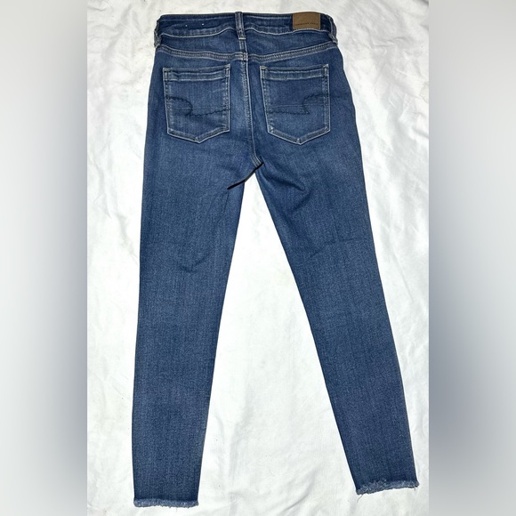 Size 4 American eagle wide front pocket. Skinny Jean frayed bottoms. No holes - Picture 2 of 3